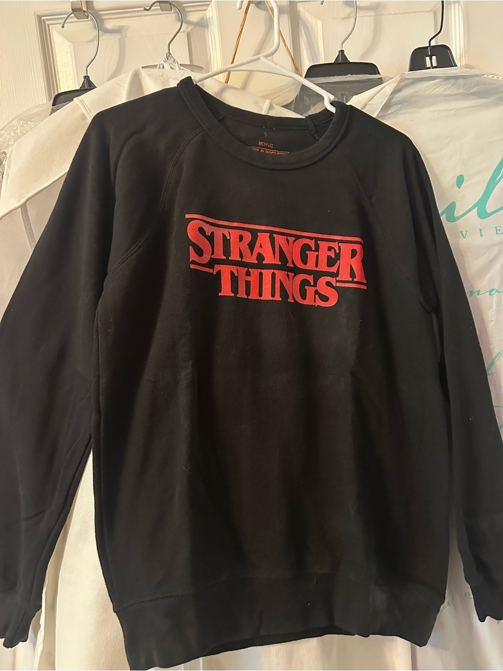 Stranger Things Black Crewneck Sweatshirt with Red Logo